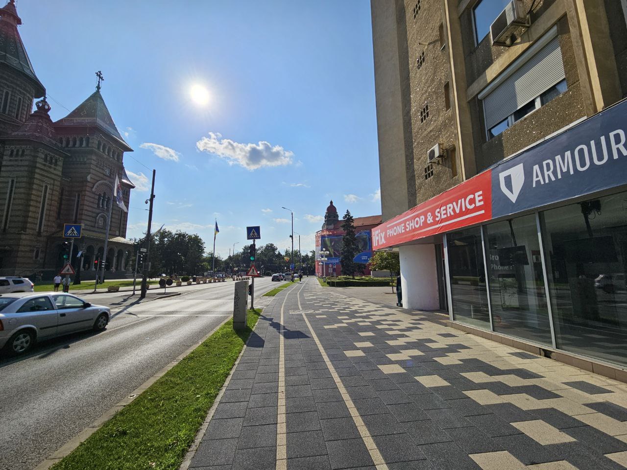 The exterior of iFix Timișoara in the Metropolitan Cathedral area, with the Armour® sign above the entrance